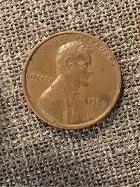 Two different Penny’s 1969 and 1969 D are UNCERTIFIED. Brownish/Copper Tone Coin